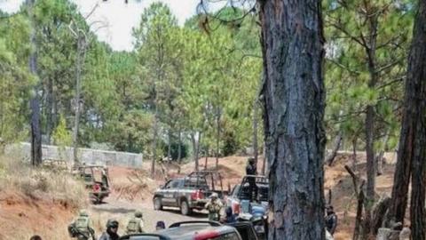 State police collect evidence in the area where there was a confrontation between criminal groups in the town of Arroyo Colorado, in the municipality of Uruapa