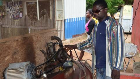 Francis Ahiale in his tyre workshop