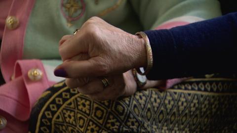 Helene Turner and Betty Harper holding hands