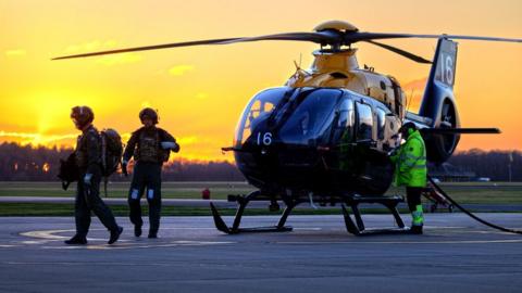 Helicopter in sunset