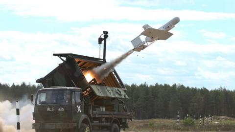 A KZO reconaissance drone of the Bundeswehr, the German armed forces, launches with the help of a booster rocket during Thunder Storm 2018 multinational Nato military exercises on June 7, 2018 near Pabrade, Lithuania.