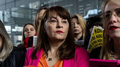 Polish activist Justyna Wydrzynska (C) speaks to journalists at the district court in Warsaw as she came for the next hearing in her case where she is accused of giving abortion assistance, on March 14, 2023