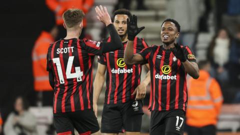 Bournemouth players celebrate scoring against Swansea