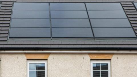 A house with solar panels on the roof