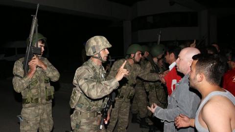 A group of soldiers try to storm into state run Turkish Radio and Television Corporation (TRT) in Ankara, Turkey on July 16, 2016