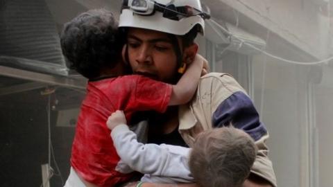 White Helmet volunteer rescues two children in Aleppo (file photo)