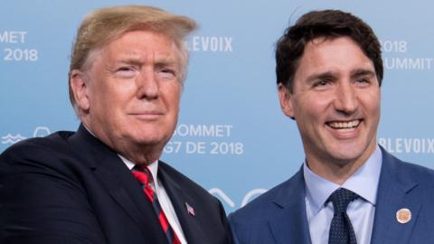 US President Donald Trump shakes hands with Canadian Prime Minister Justin Trudeau in a bilateral meeting at the G7 Summit in in Charlevoix, Quebec, Canada