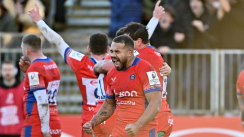 Bath players celebrate their win over Racing 92