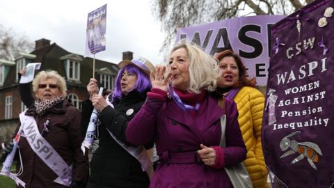 A Waspi protest in 2019, holding a banner that reads 'Waspi Women Against Pension Inequality'