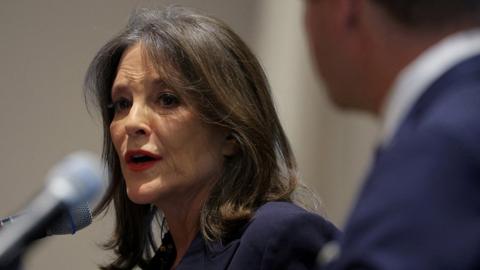 Democratic presidential candidates author Marianne Williamson and U.S. Representative Dean Phillips (D-MN) take part in the Democratic Candidate Debate at the NE College Convention 2024 in Manchester, New Hampshire, U.S., January 8, 2024