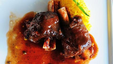 Ossobuco, a meat dish at ITC Sonar, on March 25, 2015 in Kolkata, India. Ossobuco or osso buco is Italian for 'bone with a hole' (osso bone, buco hole), a reference to the marrow hole at the centre of the cross-cut veal shank