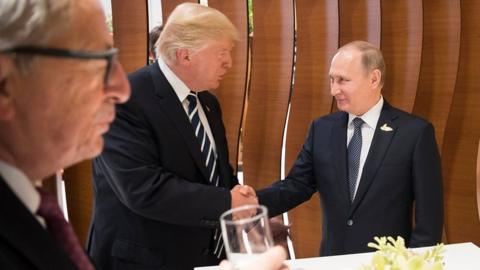 Trump and Putin shake hands