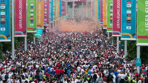 Fans walk towards Wembley before the Euro 2020 final