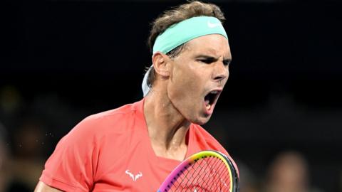 Rafael Nadal celebrates after winning a point against Dominic Thiem at the Brisbane International