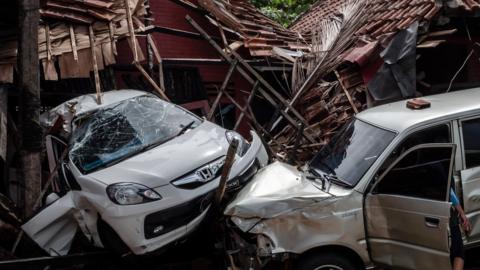 Damaged cars and buildings at a hotel resort on December 24, 2018 in Carita, Banten province, Indonesia