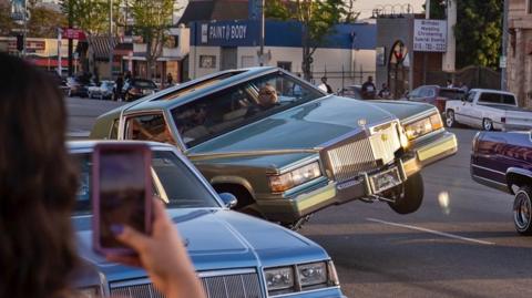 Driver cruises in lowrider