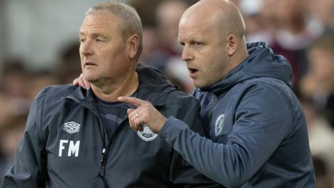 Heart of Midlothian's Frankie McAvoy and Steven Naismith