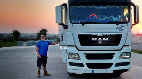 Trucker next to his truck