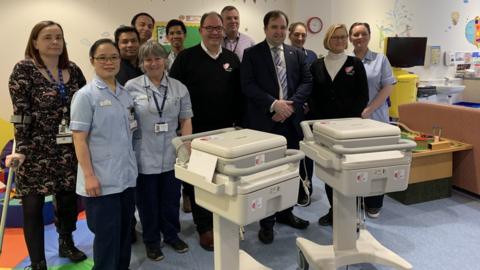 Health minister David Ashford, medical staff and members of the Manx Heart Foundation with ECG machines