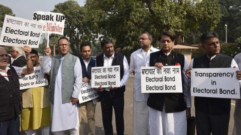 MPs from Congress protest against the lack of transparency in electoral bonds, in front of the Gandhi Statue at the Parliament during the Winter Session on November 22, 2019 in New Delhi,