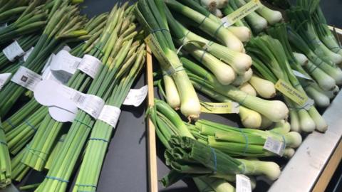 Daffodils and spring onions displayed in Marks and Spencer