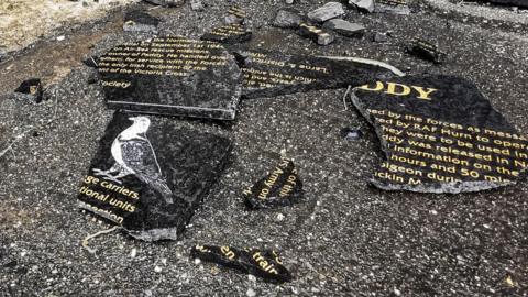 Marble plaque smashed on pavement