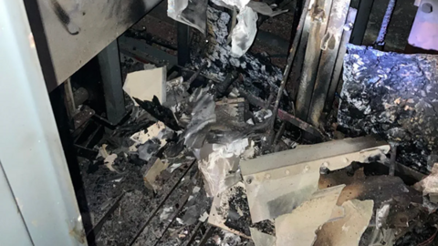 Machinery blackened by fire and no longer intact