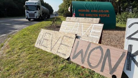 The message 'We've won' daubed on scrap wood in front of RAF Scampton in Lincolnshire. 