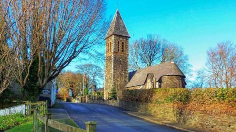 A church and tower in the village of Bride