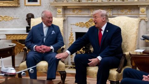 The King laughs as Donald Trump touches his thigh while the pair meet in the Oval Office.