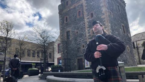 Man playing the bagpipes