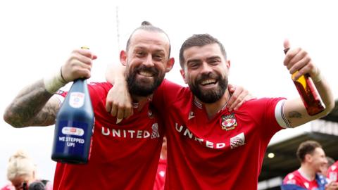 Wrexham's Stephen Fletcher and Elliot Lee celebrate promotion from League Two