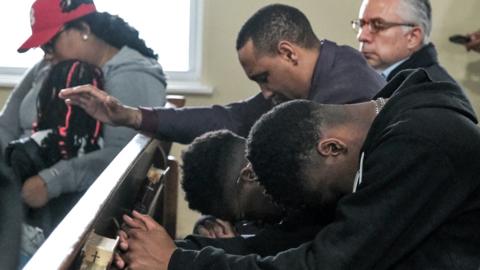 Members of the community gather at Mount Olive Baptist church for a prayer service to honour the victims of the Francis Scott Key Bridge collapse on 26 March 2024 in Baltimore