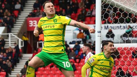 Ashley Barnes celebrates scoring Norwich's third goal at Stoke