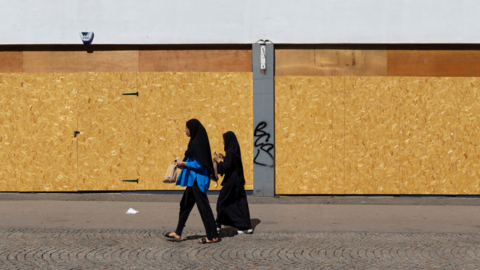 Women walking on a neglected high street