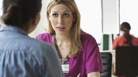 Nurse talking to patient