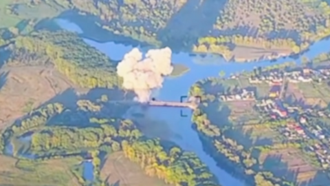 Screenshot of aerial footage showing a strike on a Russian bridge