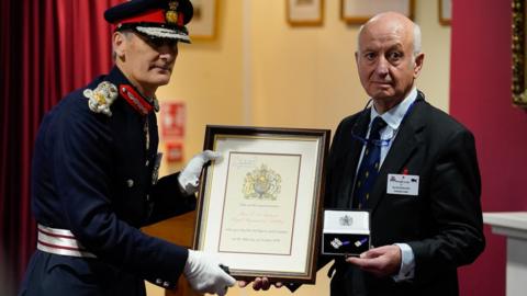 Lord Lieutenant of Hampshire Nigel Atkinson and Andrew Gillett, the nephew of Major Edwin Andrews