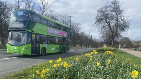 Bus driving along Otley Road near Woodhouse Moor