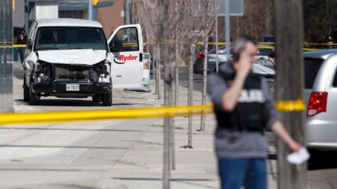 Police inspect a van suspected of being involved in a collision injuring at least eight people at Yonge St. and Finch Ave. on April 23, 2018 in Toronto, Canada.