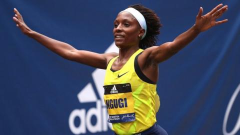 Mary Ngugi of Kenya crosses the finish line for second place during the 125th Boston Marathon on October 11, 2021 in Boston, Massachusetts, USA.