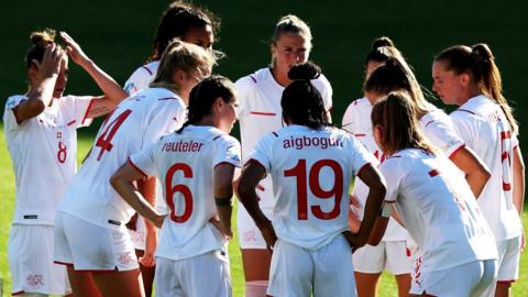 Switzerland in a team huddle
