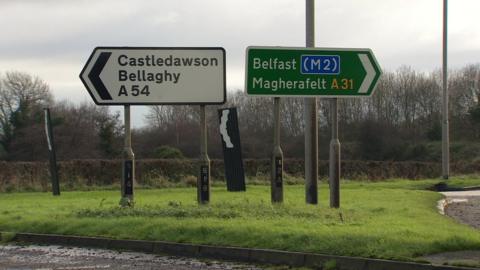 Road signs for Castledawson, Bellaghy, Belfast and Magherafelt