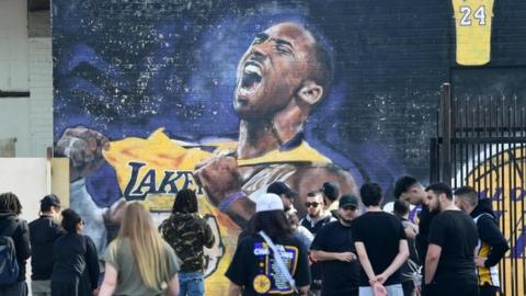 Fans gather to mourn the death of NBA legend Kobe Bryant