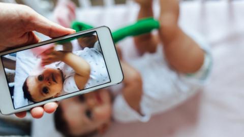 Taking picture of baby on phone