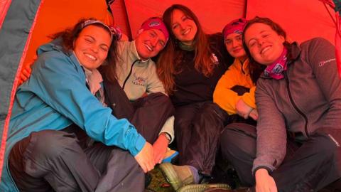 Group of women in a tent