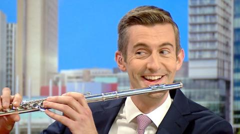 Ben Thompson playing the flute