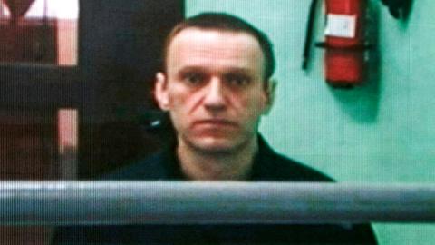 Jailed Russian opposition figure Alexei Navalny appears on a screen via a video link from his penal colony during court hearings in Moscow, 22 June 2023