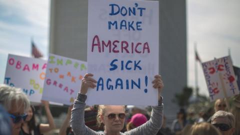 Demonstrators protest Donald Trump's policies that threaten the Affordable Care Act, Medicare and Medicaid, in Los Angeles, California, 25 January 2017