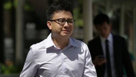 Yang Kaiheng, 27, co-founder of "The Real Singapore" website, right, arrives with his lawyer Choo Zheng Xi, left, at the State Court on Tuesday, June 28, 2016, in Singapore.